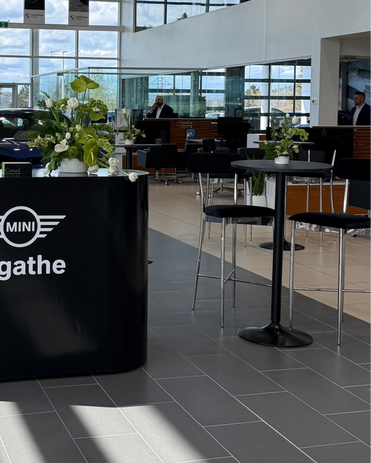 Glossy black bar - Contemporary event bar for brand activations, surrounded by modern decor