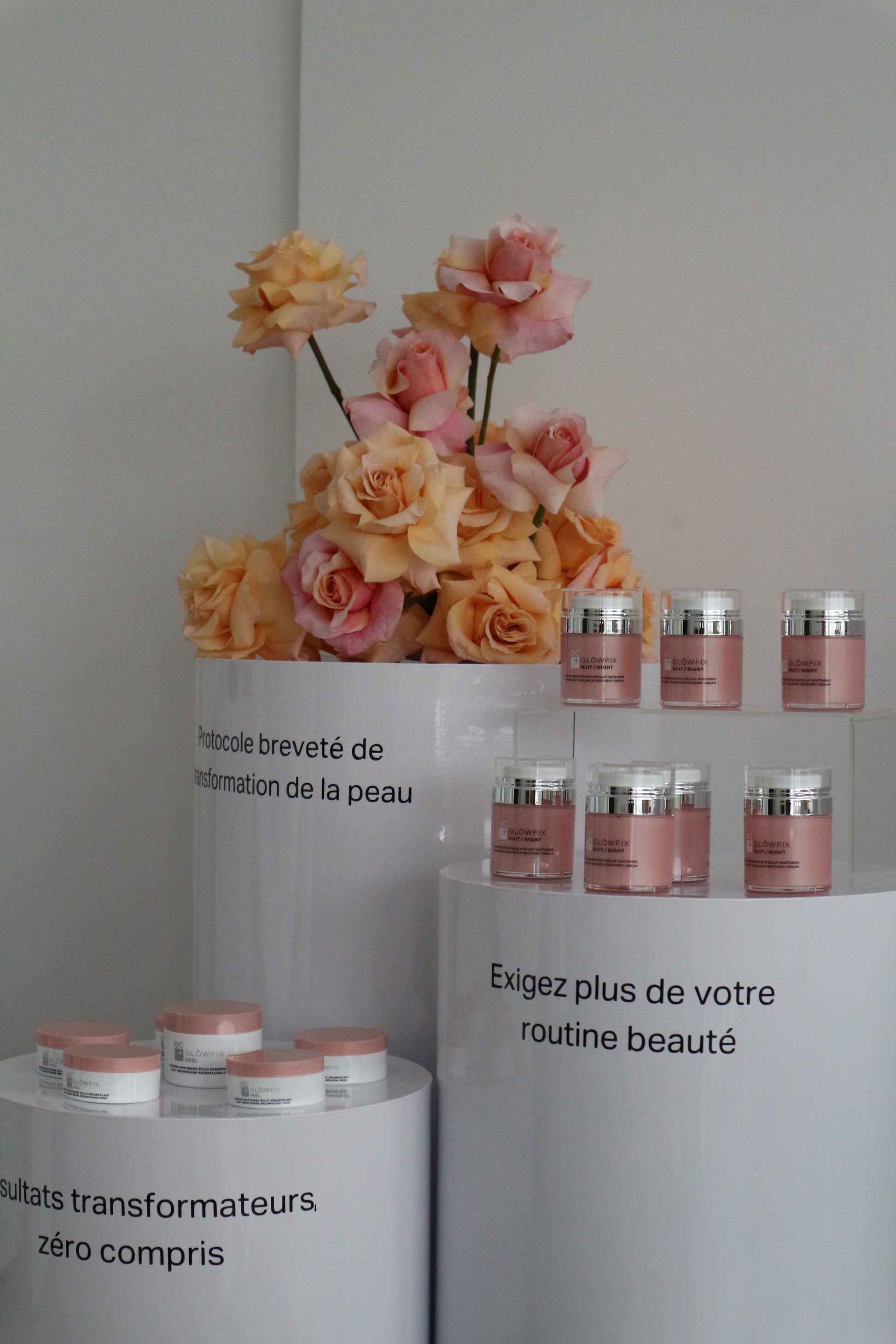 Modern round white risers used for showcasing floral arrangements, cakes, or merchandise on a clean background.