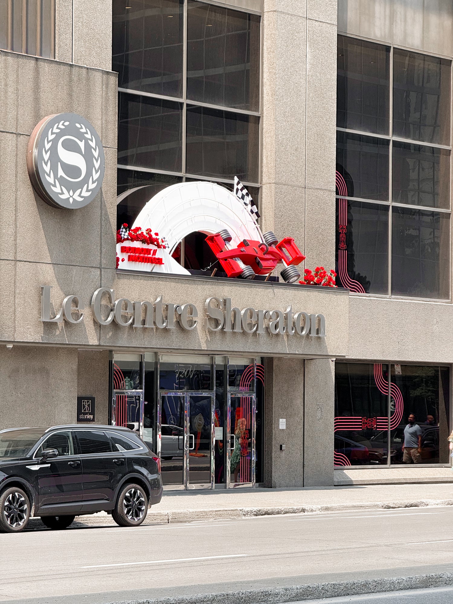 Le Centre Sheraton building with a large red and white sculpture on top